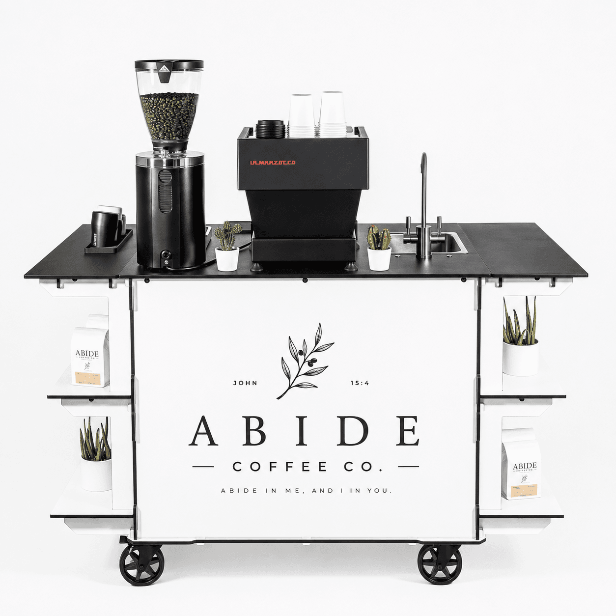 The Abide Coffee Co. mobile espresso cart, styled and ready to serve.